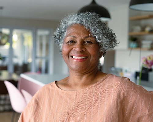 Closeup of senior woman smiling at home