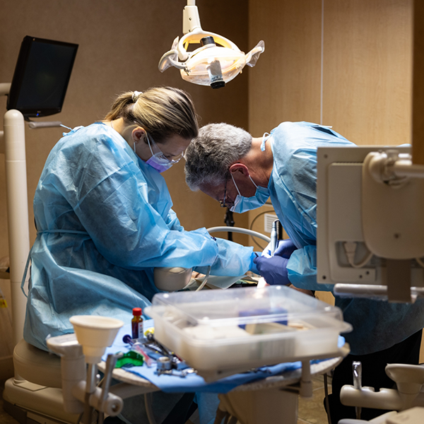 Dr Williams and another dentist treating a patient