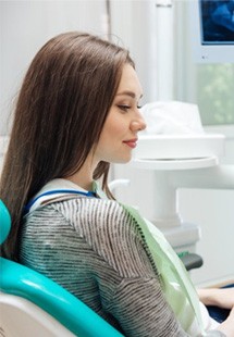 Woman learning about dental implants