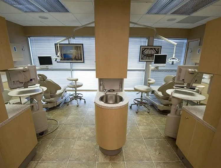 Two dental treatment areas separated by a wall